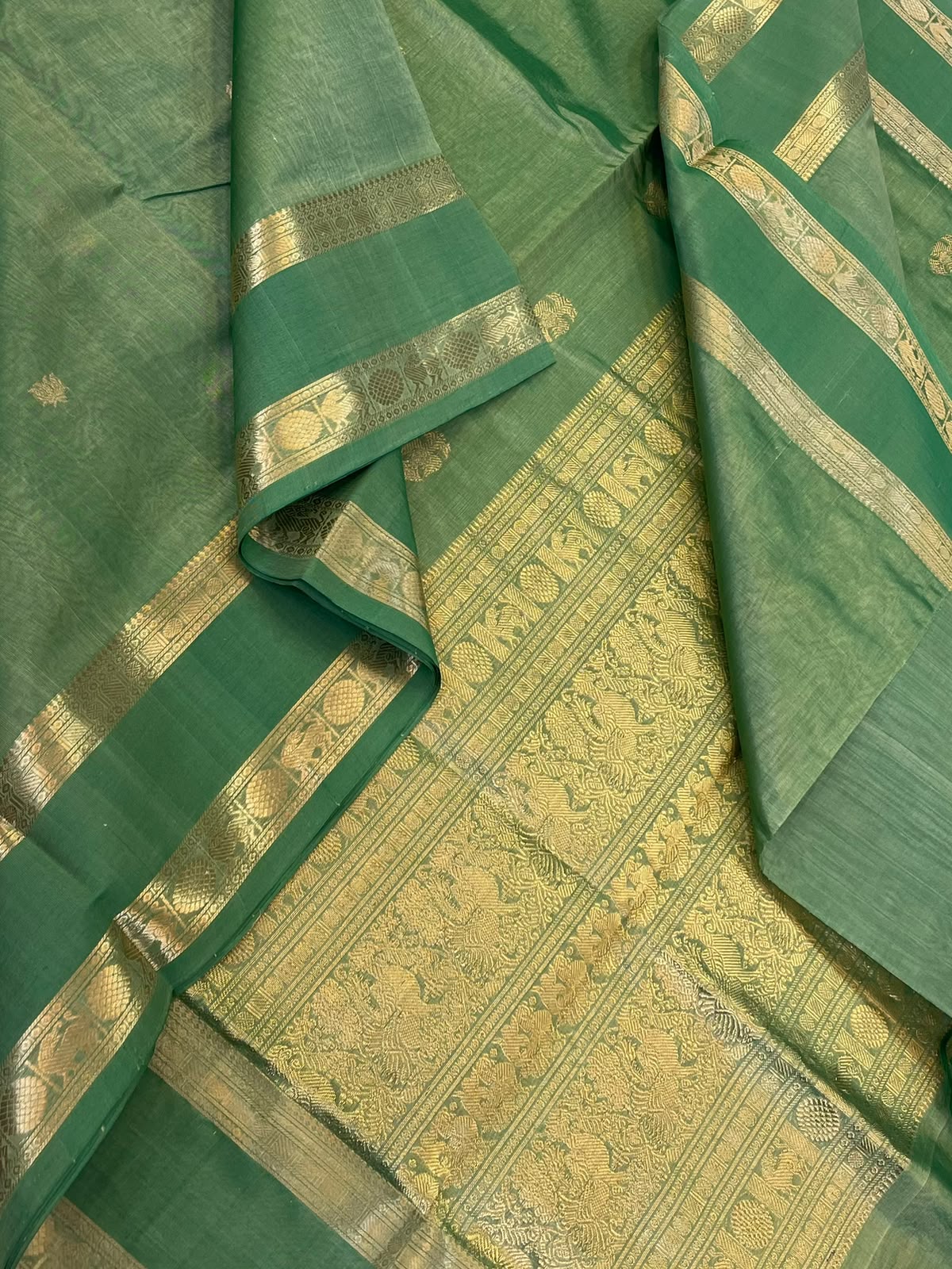 Kanchi Silk Cotton Sarees | luxury silk cotton | lotus x eruthalapakshi motif x rettaipet zari border | pastel green