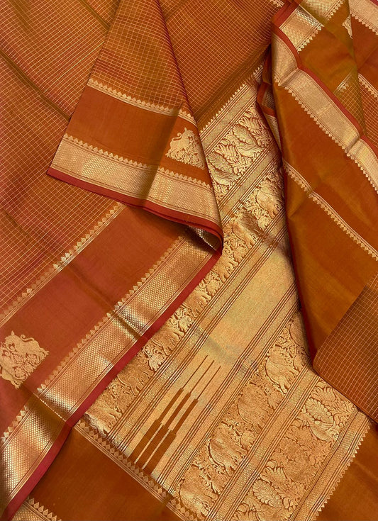 Pure Kanjivarams | rust orange X gold | muthukattam X rettai yhazli master weave pallu